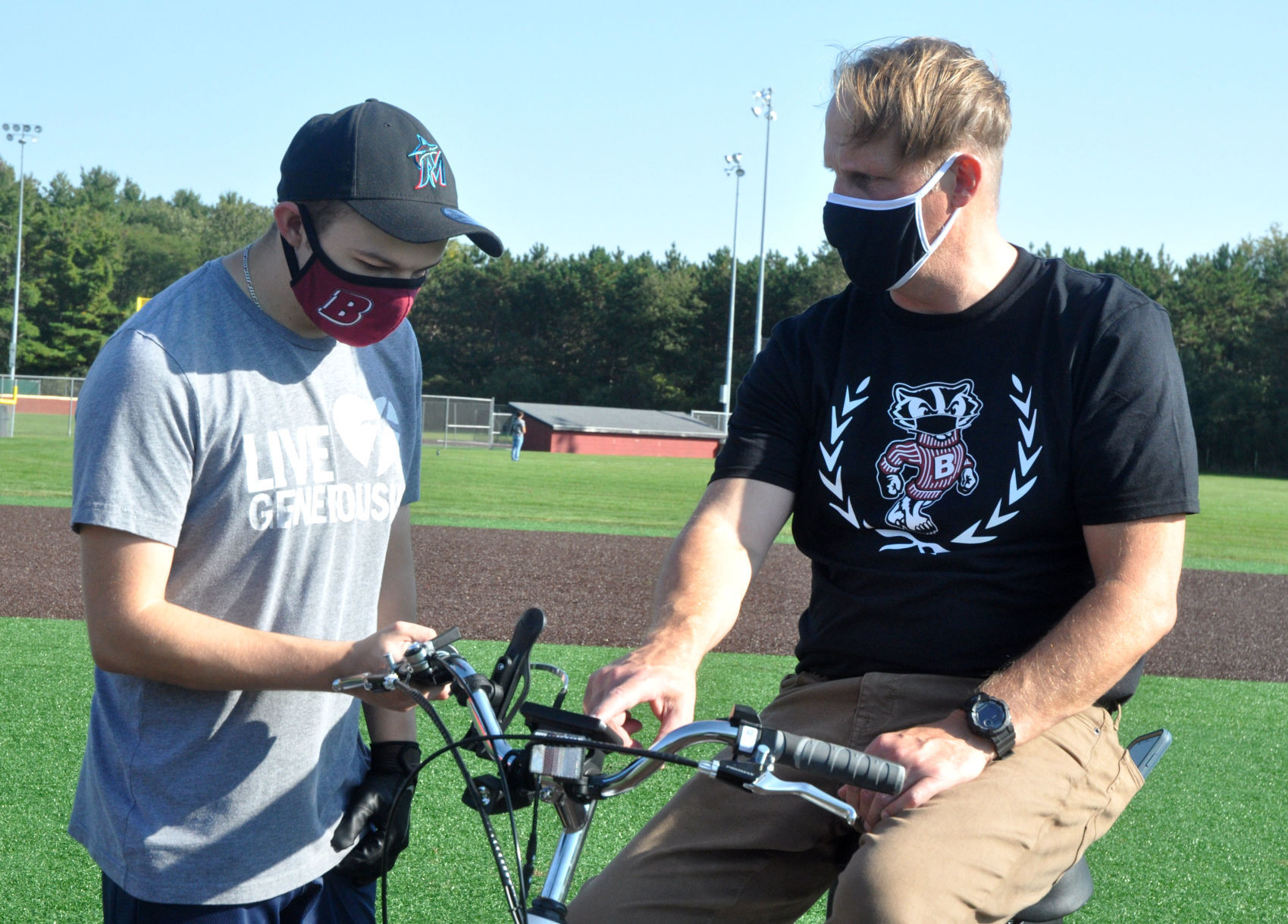 Badger High School Assistant Principal Michael Giovingo, right, shows Brooks Guif some of the features